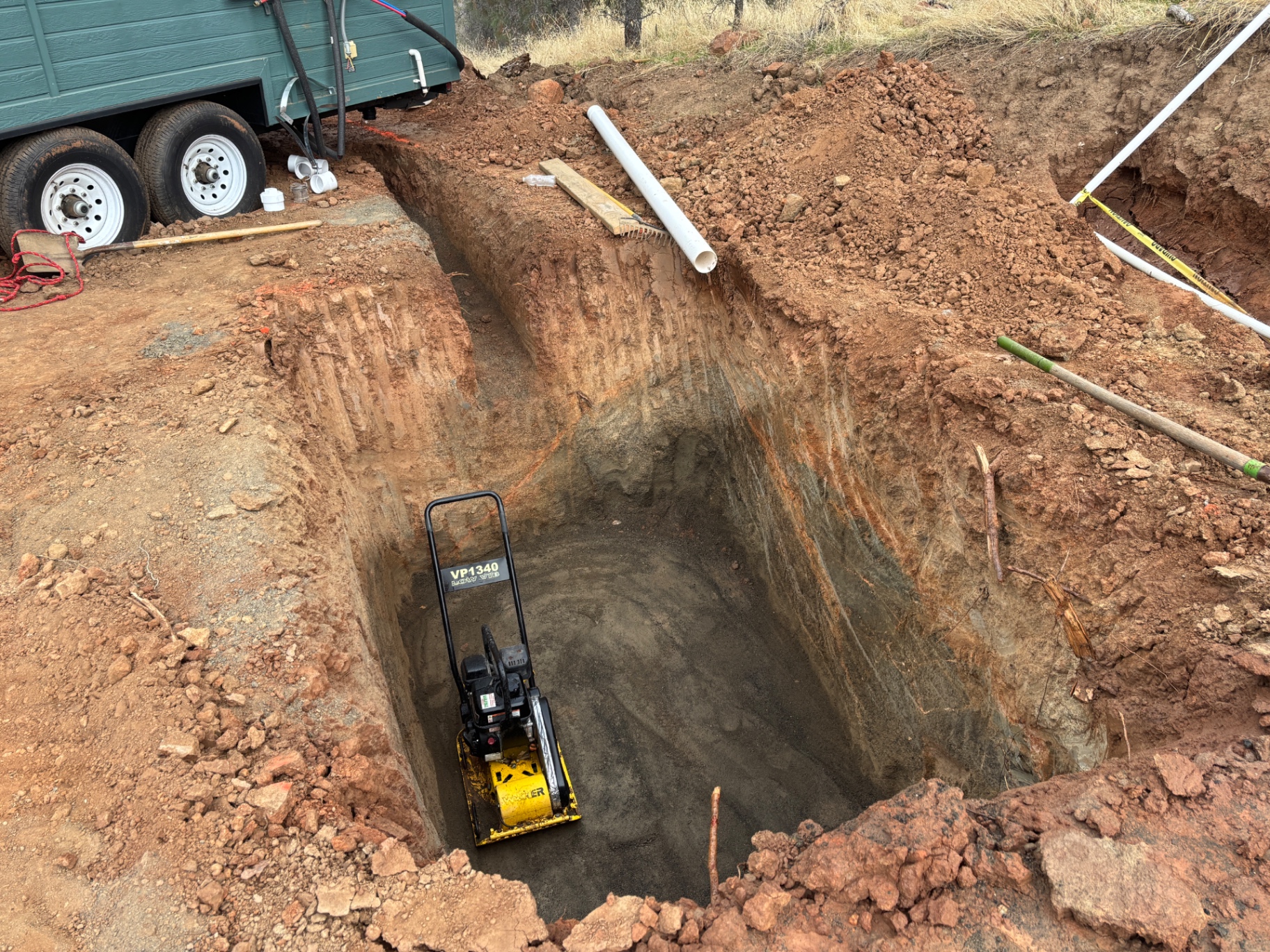 Septic pit prepped for base compaction