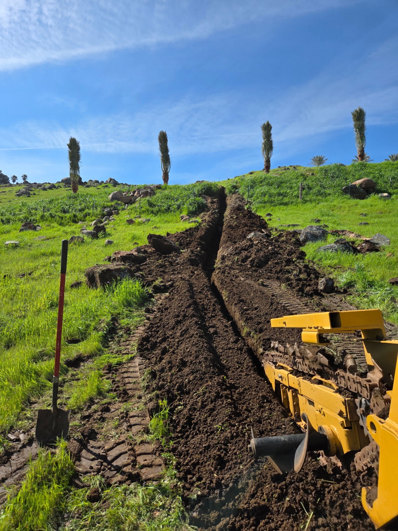 Hillside utility trench installation