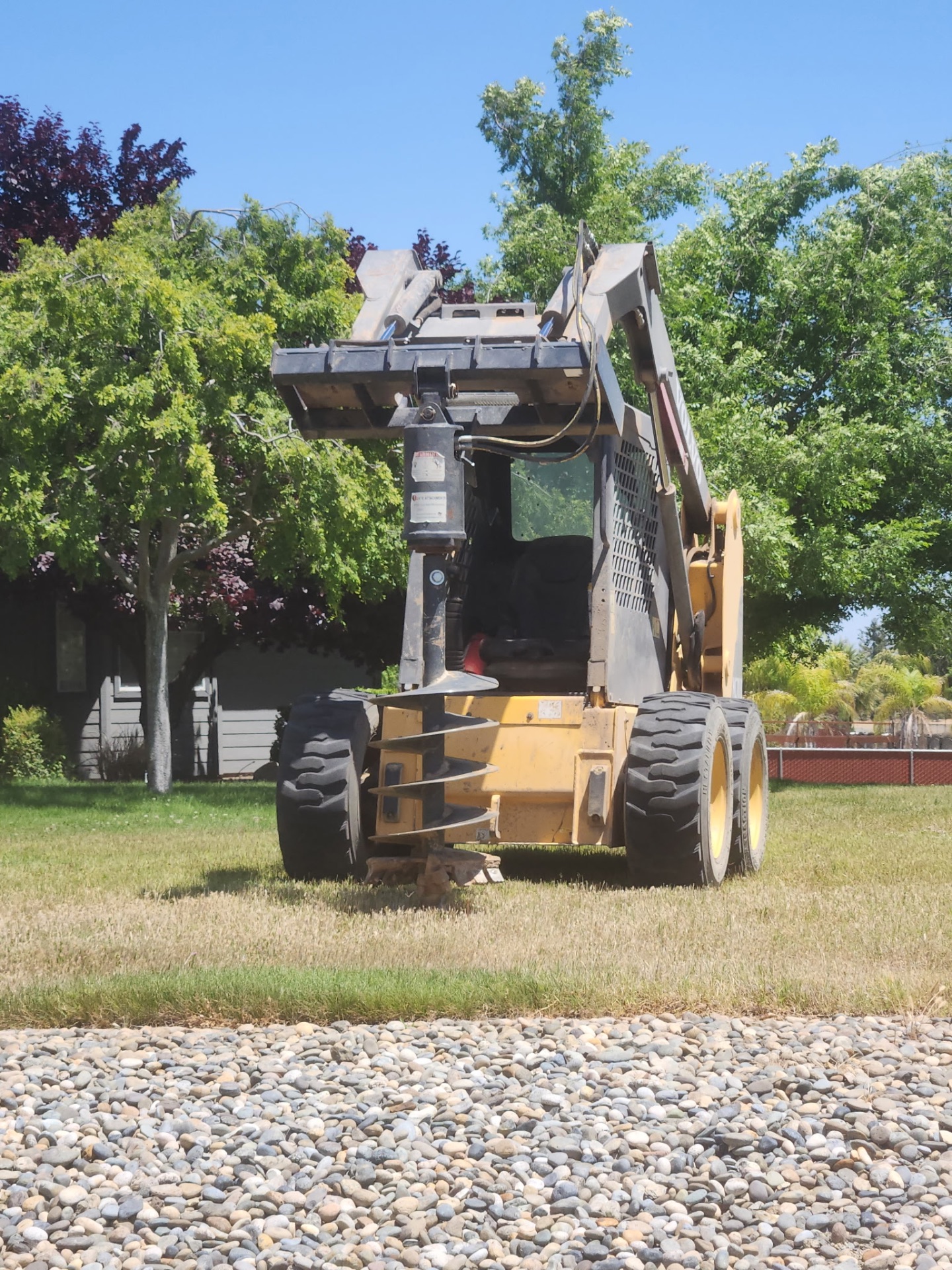 Skid steer auger setup